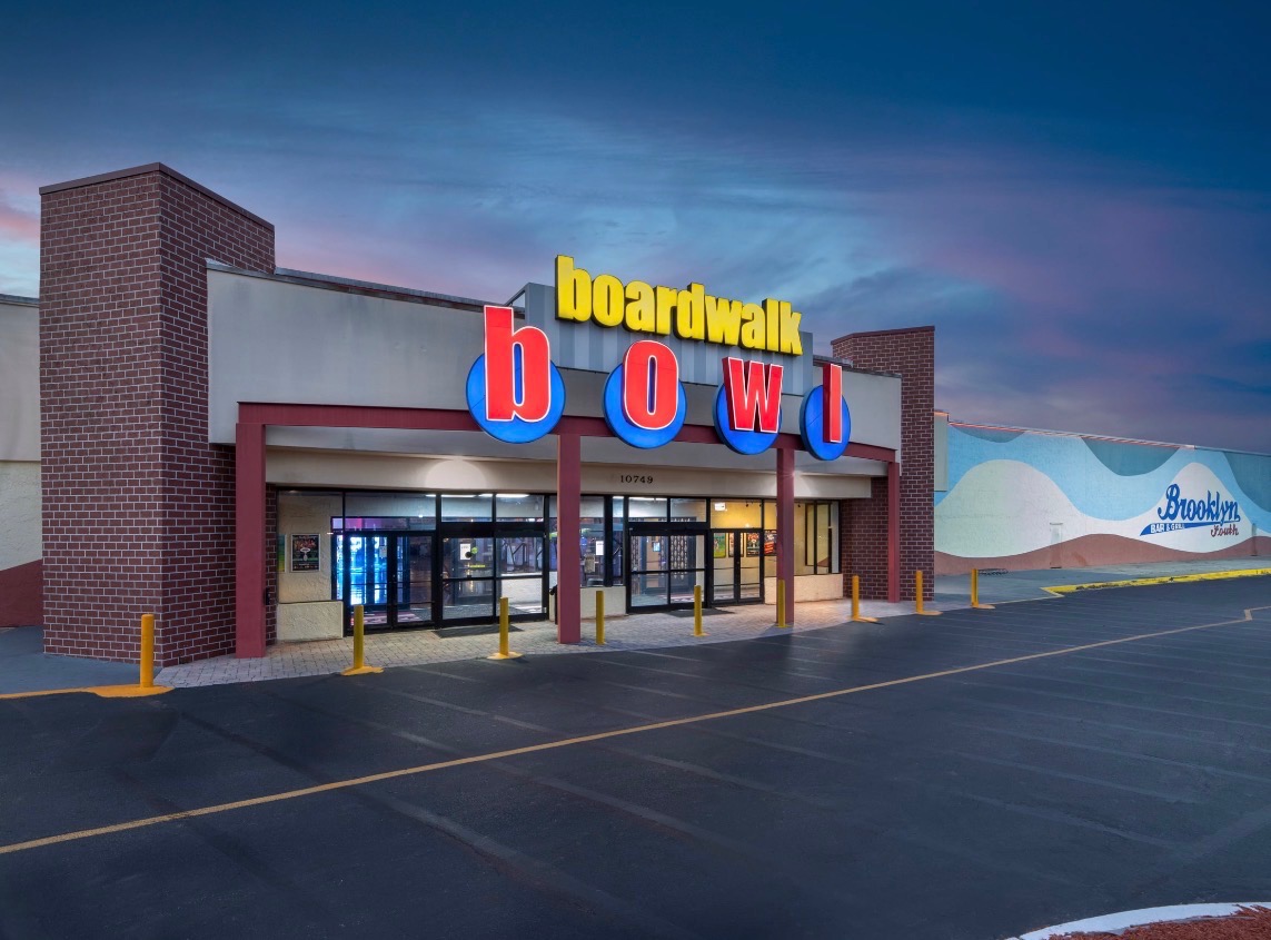 Boardwalk Bowl venue exterior lit up at dusk